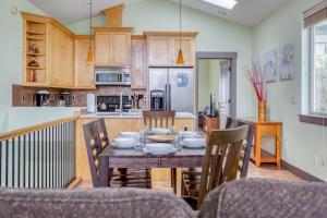 a kitchen and dining room with a table and chairs at Coastal Dream in Lincoln City