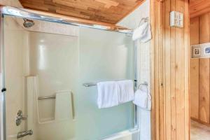 a shower with a glass door in a bathroom at Play Chalet MCA 489 - Meredith Lodging in Manzanita +60 photos