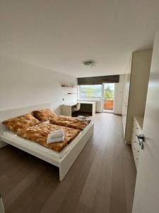 a bedroom with a bed and a desk in it at Great spacious villa near Prague 