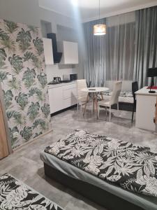 Kuchyň nebo kuchyňský kout v ubytování Eldom-Noclegi Rogozińska 29E + 22 fotografií