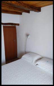 Cama o camas de una habitación en Appartamento Su Piricocco - La casa dei ricordi