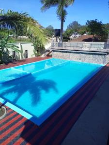 a large blue swimming pool on top of a roof at Lush Garden Camping in Arusha