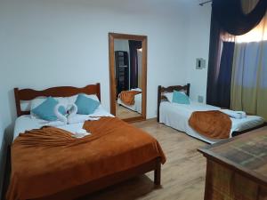 Ένα ή περισσότερα κρεβάτια σε δωμάτιο στο Casa do Aconchego