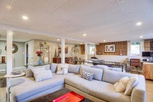 a living room with a couch and a table at Pet-Friendly Narragansett Home with Deck and Gas Grill in Narragansett
