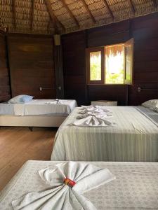 Ένα ή περισσότερα κρεβάτια σε δωμάτιο στο Estrela dos Lençóis
