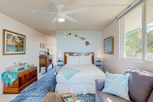 a bedroom with a bed and a couch at Hale Li'ili'i at Keawakapu #201 in Wailea