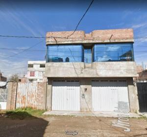 a building with a large window on top of it at Apartamento en Huancayo in Huancayo