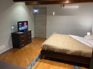 Postel nebo postele na pokoji v ubytování La casa di Cate & Adry