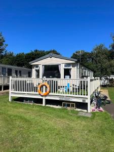 a house with a porch with a gazebo at Seton Sands Holiday Village Klover in Port Seton