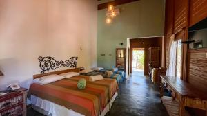 a bedroom with two beds in a room at Pousada Rancho da Serra in Martins