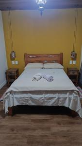 Cama ou camas em um quarto em Recanto Rio da Montanha no Patrimônio da Penha