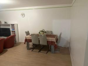 a dining room with a table and chairs at DLTA Hote in Torcy