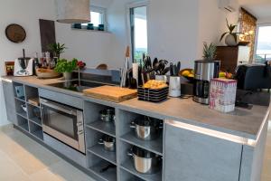 a kitchen with a counter top with food on it at The Grand View Villa in Njivice