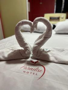 Postel nebo postele na pokoji v ubytování Hotel Paradise