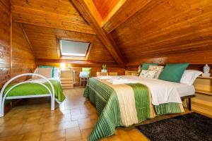 a bedroom with a bed and a wooden ceiling at Il Terrazzino 51 in Bellagio
