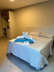 Ένα ή περισσότερα κρεβάτια σε δωμάτιο στο Jardim do Rio Suítes