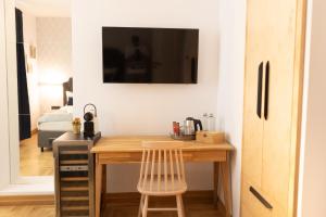 a kitchen with a wooden desk in a room at Luxury rooms 12-1 in Plovdiv