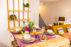 a dining room table with a plate of food on it at Bamboo house in Saint-François