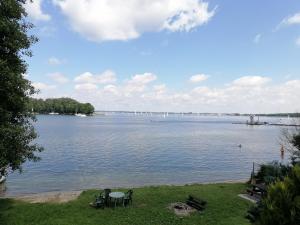 a view of a large body of water at Apartamenty nad jeziorem ,,Odpocznij" in Rydzewo