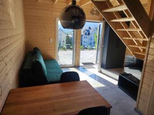 a living room with a couch and a table at Tyrolska Chata in Świeradów-Zdrój