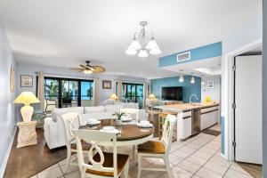 a kitchen and living room with a table and a couch at Bayview Condo B in Bradenton Beach