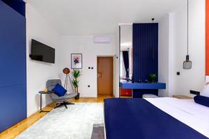 Ένα ή περισσότερα κρεβάτια σε δωμάτιο στο Crown Apartments