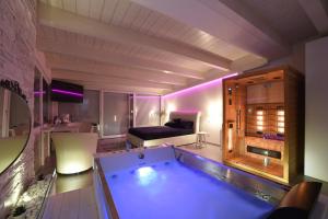 a large bathroom with a tub in a room at Italians b&b luxury suite in Acquaviva delle Fonti
