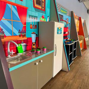a toy kitchen with a sink and a refrigerator at Thermas São Pedro Park Resort in São Pedro +21 photos