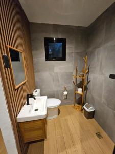 a bathroom with a sink and a toilet at Como River Retreat in Cavinti