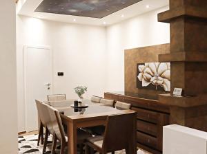 a dining room with a table and chairs at Capital apartments Sarajevo in Sarajevo