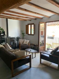 a living room with a couch and a table at Casa Valleta in Tivenys