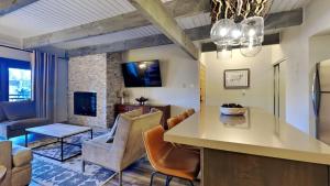 a kitchen and living room with a couch and a table at Timberline Condominiums 1 Bedroom Premier Unit D2B in Snowmass Village