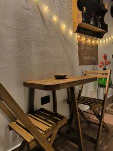 a wooden table with a bowl on top of it at BELLEVUE APARTMENTS in Sant'Agata de' Goti +43 photos