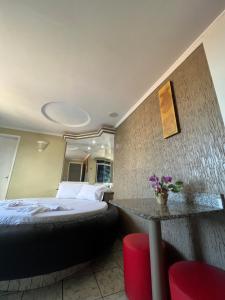 Postel nebo postele na pokoji v ubytování Hotel Paradise