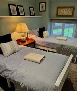 Katil atau katil-katil dalam bilik di Fletchers Cottage