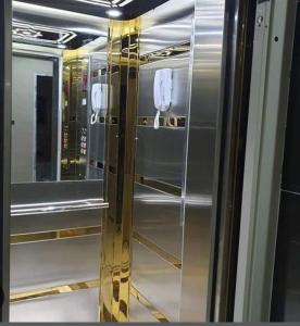 a stainless steel refrigerator in a room with mirrors at Shafa Badran apt in Amman
