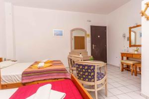 Postel nebo postele na pokoji v ubytování Alexander Beach Hotel