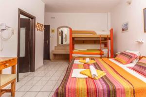 Postel nebo postele na pokoji v ubytování Alexander Beach Hotel
