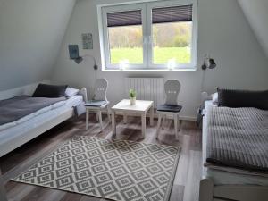 a living room with a couch and a table at Schlei-Perle in Kappeln
