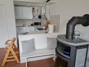 a kitchen with a stove in the middle of a room at Schlei-Perle in Kappeln