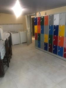 a room with colorful tiles on the wall at Hospedagem e kitnetes D' Itália in Curitiba +30 photos