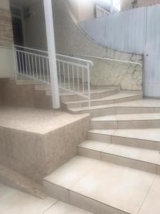 a set of stairs in a building at Hospedagem e kitnetes D' Itália in Curitiba