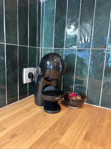 a coffee maker sitting on top of a table at STUDIO avec PISCINE in Carmaux