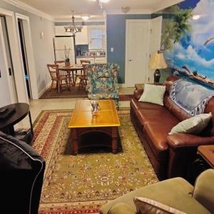 a living room with a couch and a coffee table at Unique 2 Bedroom / 2 Bath Condo in Myrtle Beach in Myrtle Beach