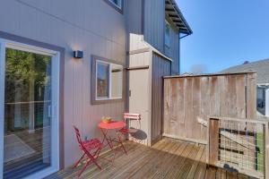 a patio with two chairs and a table on a deck at Airy Fortuna Apartment with Deck! in Fortuna