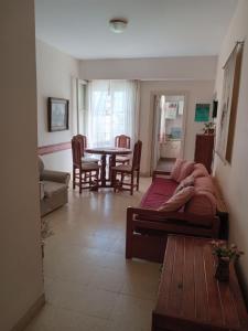 a living room with a bed and a table at depto pleno centro a 3 cuadras del mar in Mar del Plata