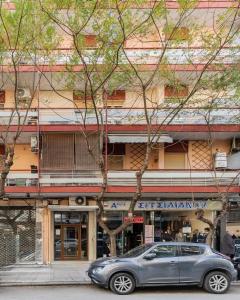 a silver car parked in front of a building at Oasis Diamond Suite in Thessaloniki