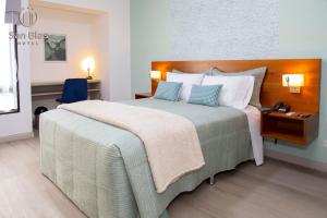 Postel nebo postele na pokoji v ubytování Hotel San Blas