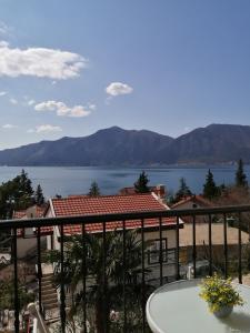 a view of the water from the balcony of a house at Apartments FANTASY in Kotor
