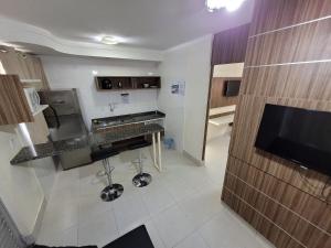 a kitchen with a sink and a counter top at Lacqua diRoma RM Hospedagem in Caldas Novas